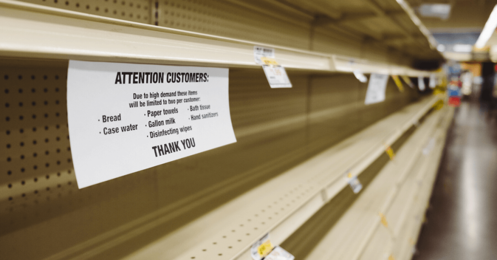 empty shelves with stock purchase limit signage