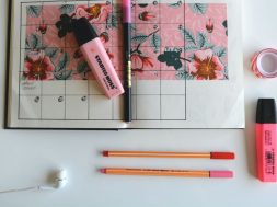 A-diary-on-a-desk-with-pink-highlighters-and-pens.jpg