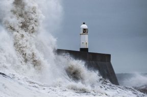 Stormy-seas-and-lighthouse-by-Marcus-Woodbridge-Unsplash.jpg