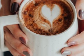 Woman-holding-mug-of-hot-chocolate.jpg