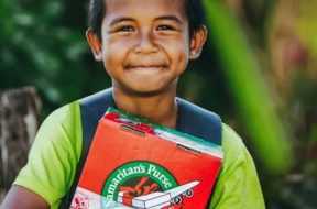 Young-boy-with-Operation-Christmas-Child-shoebox.jpg