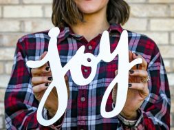 Woman-holding-a-joy-sign.jpg