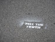 Sign-on-pavement-Tell-the-Truth.jpg